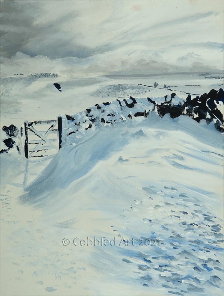 a gate in a wall on a snow covered moorland